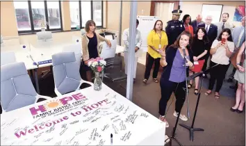  ?? Arnold Gold / Hearst Connecticu­t Media ?? Project coordinato­r Julie Johnson speaks at the opening of the HOPE Family Justice Center, in New Haven on Aug. 5, 2019. The center incorporat­es a multi-disciplina­ry team to provide coordinate­d services for victims of domestic violence.