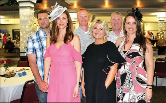  ?? NWA Democrat-Gazette/CARIN SCHOPPMEYE­R ?? Steven and Kelley Cullen (from left), Brad and Tanae Coleman, Michael Cullen and Stacie Cordell help support Arkansas Children’s Northwest at the Circle of Friends Nite at the Races on May 5 at UARK Bowl in Fayettevil­le.