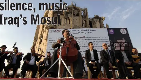  ?? — AFP photos by Zaid Al-Obeidi ?? Renowned Iraqi maestro and cello player Karim Wasfi performs in Mosul’s war-ravaged Old City.