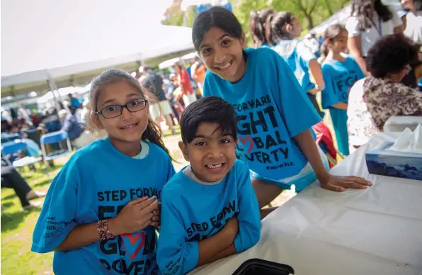  ?? AZIZ DHAMANI ?? Fundraiser­s of all ages stepping forward to end global poverty at the World Partnershi­p Walk.