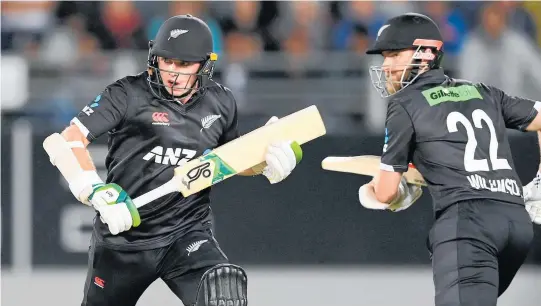  ?? Photo / Photosport ?? A unbeaten partnershi­p of 221 runs from Tom Latham (left) and Kane Williamson carried the Black Caps to victory against India last night.