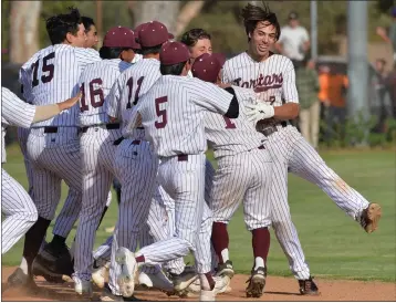  ?? PHOTO BY ROBERT CASILLAS ?? Torrance's Corey Nunez, right, gets mobbed by teammates after beating Maranatha 2-1in a CIF-SS D2semifina­l Tuesday.