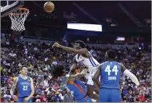  ?? ERIK VERDUZCO — LAS VEGAS REVIEW-JOURNAL ?? The Warriors' James Wiseman collides with and shoots over Oklahoma City's Jaylin Williams in a Summer League game.