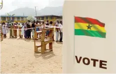  ?? — Reuters ?? People wait to vote at a polling station in Kibi, eastern region of Ghana.