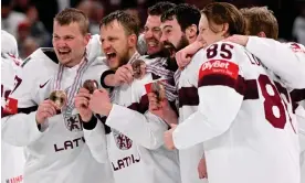  ?? United States. Photograph: Jonathan Nackstrand/AFP/Getty Images ?? Latvia celebrate with their bronze medals after their world championsh­ip victory over the