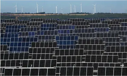  ?? Photograph: Pablo Blázquez Domínguez/Getty Images ?? A solar farm with a windfarm in the background in El Bonillo, Spain. The EU’s existing Covid recovery plans have made €250bn available for green measures.