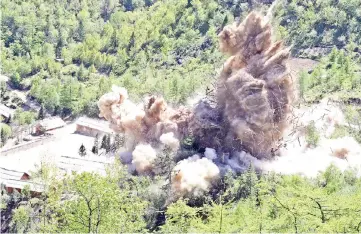  ??  ?? A command post and barracks of Punggye-ri nuclear test ground are blown up during the dismantlem­ent process in Punggye-ri,North Hamgyong Province, North Korea. — Reuters photo