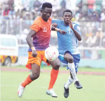  ??  ?? Abe Sunday (left) of Sunshine and Abayomi Junior (right) of 3SC contest for the ball during a league match in the just-concluded Nigeria Profession­al Football League season