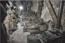  ?? AP photo ?? Soldiers of the Ukrainian 3rd Army Assault Brigade of the Special Operations Forces (SSO) “Azov” rest in a blindage after night fight near Bakhmut, Donetsk region, Ukraine, on Saturday.