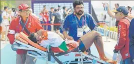  ?? PTI ?? Rower Dushyant Chauhan being taken for medical help after falling sick during the medal ceremony.