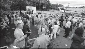  ?? NWA Democrat-Gazette/ANDY SHUPE ?? A crowd gathers Friday during a groundbrea­king for TheatreSqu­ared’s new facility at 477 W. Spring St. in Fayettevil­le. Designed by Marvel Architects and Charcoalbl­ue, the building will feature two theaters, a rehearsal space, offices, education and community space, on-site design and building workshops, eight guest artist apartments, three levels of outdoor public spaces and a cafe and bar that will remain open during the day.