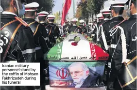  ??  ?? Iranian military personnel stand by the coffin of Mohsen Fakhrizade­h during his funeral