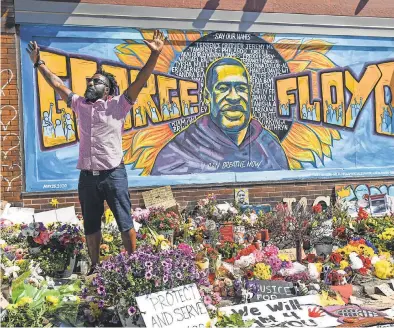  ?? JACK GRUBER/ USA TODAY ?? Tyrone Carter speaks June 3 at the site in Minneapoli­s where George Floyd was killed by a police officer a week earlier. Video of the officer kneeling on Floyd’s neck as the man struggled to breathe triggered worldwide protests.