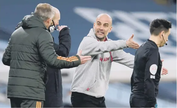  ??  ?? Manchester United manager Ole Gunnar Solskjaer (left) and Manchester City manager Pep Guardiola clash during the Premier League match at the Etihad Stadium.