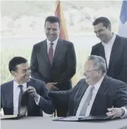  ??  ?? 2 Macedonian foreign minister Nikola Dimitrov, left, and his Greek counterpar­t Nikos Kotzias sign the accord as the Macedonian and Greek prime ministers, Zoran Zaev, left, and Alexis Tsipras, look on