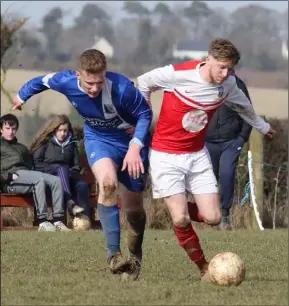  ??  ?? Stephen Ryan of Tombrack challenges John Peare of Moyne Rangers.