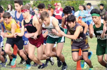  ?? MIKE BUSH/NEWS-SENTINEL ?? Liberty Ranch runner Collin Ullrich, center, leaves the starting line with his opponents during the Sac-Joaquin Section Cross Country Division IV championsh­ip race on Friday at Willow Hills in Folsom.