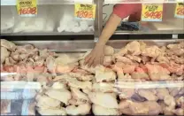  ?? PHOTO: REUTERS ?? Chicken meat for sale in a butchery after the Chilean government suspended all meat and poultry imports from Brazil, in Santiago, Chile, on Wednesday. The question now is: Who can replace Brazil as a source of supplies?