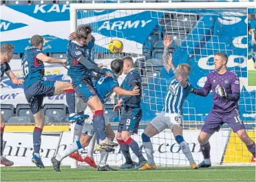  ??  ?? County’s Alex Iacovitti (16) rises highest to head home their equaliser and make it 2-2