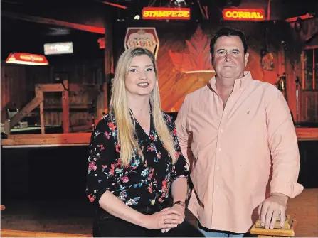  ?? BRENT DAVIS WATERLOO REGION RECORD ?? Stampede Corral co-owners Lauren Buckley and Andrew Mackay are pictured Wednesday near the stage at the Kitchener nightspot. The venue will be closing next month after 35 years in business.