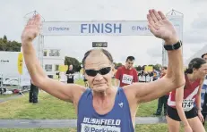  ??  ?? Great Eastern Run ever-present Eric Winstone after completing the race.