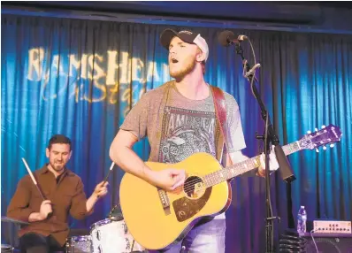  ?? PAUL W. GILLESPIE/CAPITAL GAZETTE ?? Jackson Dean Nicholson warms up with his band during soundcheck ahead of his sold-out show at Rams Head On Stage in Annapolis on Saturday. The 18-year-old from Odenton has received national attention after his performanc­e of the national anthem went viral.