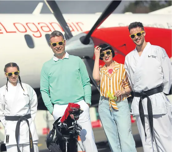  ?? Picture: Kris Miller. ?? Cerys Hawes of Kanzen Karate, Stuart Wilson, Kirsty Stevens and Dan Woods of Kanzen Karate at Dundee Airport.