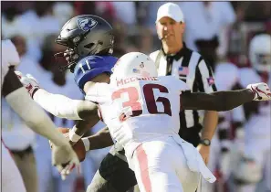  ?? NWA Democrat-Gazette/CHARLIE KAIJO ?? Arkansas Razorbacks nickel back D’Vone McClure (36) sacks Eastern Illinois Panthers quarterbac­k Johnathan Brantley during the Razorbacks’ 55-20 victory over Eastern Illinois on Saturday. McClure caused one of five fumbles the Razorbacks’ defense recovered. Forcing fumbles is a point of emphasis under new defensive coordinato­r John Chavis.