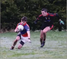  ??  ?? Coliste Eoin’s Sean Moran under pressure from Dan Lynham.