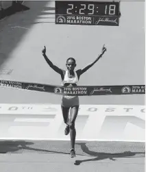  ?? CHARLES KRUPA/THE ASSOCIATED PRESS ?? Atsede Baysa of Ethiopia crosses the finish line to win the women’s division of the Boston Marathon.