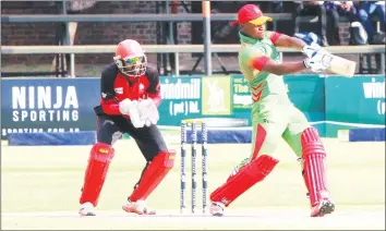  ??  ?? MAKING A DIFFERENCE . . . Chamu Chibhabha strikes the ball on his way to a half-century which helped Zimbabwe A overcome Canada at Harare Sports Club yesterday