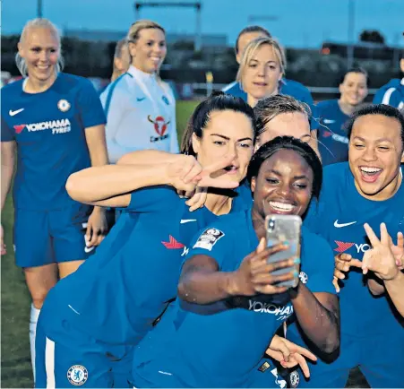  ??  ?? We are the champions: Chelsea Ladies celebrate after wrapping up the Women’s Super League title with a game to spare last season