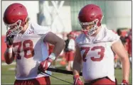  ??  ?? Offensive linemen Dalton Wagner (left) and Noah Gatlin were set up for a position battle in 2019 before Gatlin suffered a torn knee ligament early in training camp. Wagner, who started 12 games at right tackle last season, earned his most substantia­l playing time of the season after coming in for Gatlin on the second snap of last week’s loss to Auburn.
(NWA Democrat-Gazette/Andy Shupe)