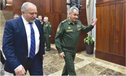  ?? (Ariel Hermoni/Defense Ministry) ?? DEFENSE MINISTER Avigdor Liberman and his Russian counterpar­t, Sergei Shoigu, walk to their meeting in Moscow yesterday.