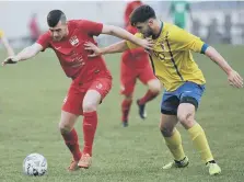  ??  ?? Washington’s Vinny Gash (red) tries to create an opening against RCA.