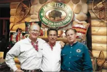  ?? Courtesy of Charles Gordon ?? Harrison Trask, left, and John Brewer, both of HS Trask, flank Gordon’s Shoes owner in the then-newly constructe­d log cabin on the second floor of the Gordon’s store in Bloomfield in the early 1990s.