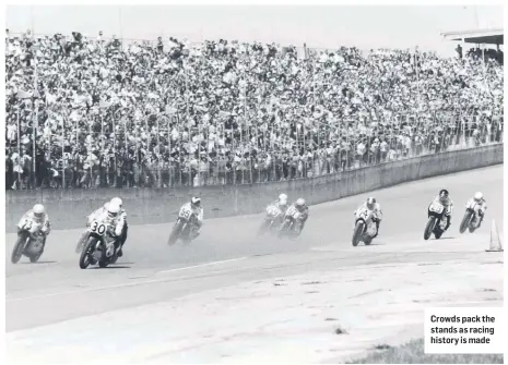  ?? ?? Crowds pack the stands as racing history is made