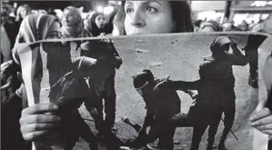  ??  ?? Images of a female protester being beaten by riot police triggered rallies in the capital Cairo