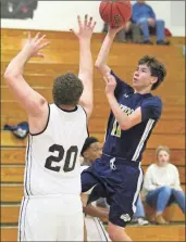  ?? / Scott Herpst, file ?? Oakwood’s Jacob Wellwood puts up a shot over Ridgeland’s Dillon Johnson during a recent contest. Wellwood and the Eagles went 1-1 last week, but still began the new week with a record over .500.