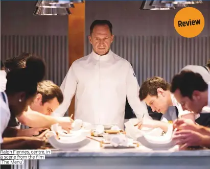  ?? ?? Ralph Fiennes, centre, in a scene from the film ‘The Menu’.