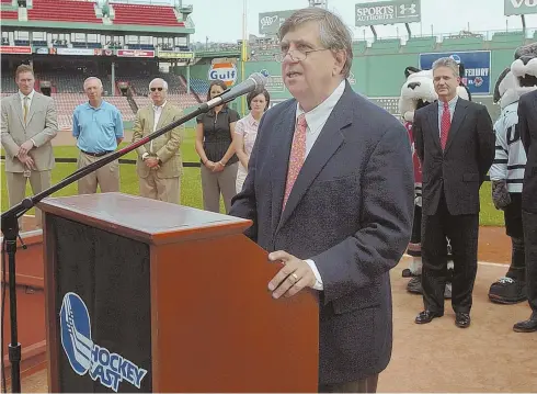  ?? STAFF FILE PHOTO BY PATRICK WHITTEMORE ?? HEAD OF THE CLASS: Hockey East commission­er Joe Bertagna, shown speaking during a past press conference for Frozen Fenway, will be among those inducted in the Massachuse­tts Hockey Hall of Fame tonight in Plymouth.