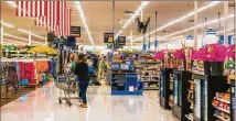  ?? ANDREI GABRIEL STANESCU / DREAMSTIME ?? A new app called Even lets Walmart store employees get a portion of their pay for hours they’ve already worked, though some are concerned about its guidelines.