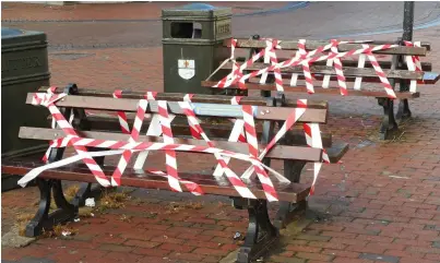  ??  ?? Move along: Taped benches in Ely, Cambridges­hire. They are seen as potential infection sites