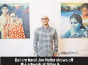  ??  ?? Gallery hand Jon Heller shows off the artwork at Gitler & ___.