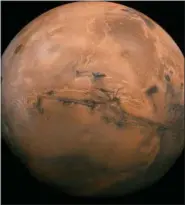  ?? NASA VIA AP, FILE ?? FILE - This image made available by NASA shows the planet Mars. This composite photo was created from over 100 images of Mars taken by Viking Orbiters in the 1970s. In our solar system family, Mars is Earth’s next-of-kin, the next-door relative that has captivated humans for millennia. The attraction is sure to grow on Monday, Nov. 26 with the arrival of a NASA lander named InSight.