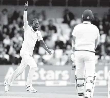  ?? AP PHOTOS ?? England’s Jofra Archer celebrates after taking his fifth wicket, that of Australia’s Pat Cummins (right) caught by Jonny Bairstow for 0 on the first day of the third Ashes Test cricket match between England and Australia at Headingley cricket ground in Leeds, yesterday.