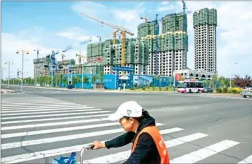  ?? YORK TIMES GILLES SABRIE/THE NEW ?? Buildings under constructi­on in the northeaste­rn city of Qiqihar, China, on September 3.