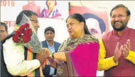  ?? PRABHAKAR SHARMA/HT PHOTO ?? (Above) Former chief minister Vasundhara Raje greets newly elected leader of opposition Gulab Chand Kataria along with Union HRD minister Prakash Javdekar; (below) Raje greets newly elected deputy leader of opposition Rajendra Singh Rathore at party office on Sunday.