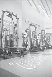  ??  ?? THE WEIGHT ROOM at the shiny, new facility is named after Bruins alumnus Kevin Love.