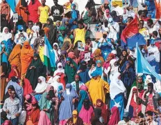  ?? AFP ?? Demonstrat­ors hold flags during a rally against the AlShabaab jihadist group in Mogadishu on January 12.